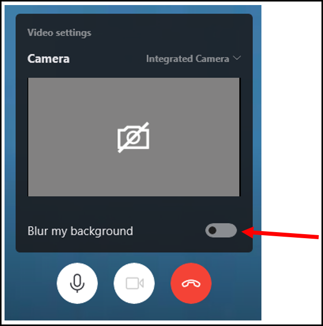 Title: Video Settings during Skype call on Desktop computer - Description: A screenshot of 'Video Settings' accessed during a Skype call. The screeenshot features a grey square containing the image of a white camera with a line through it. Below the square there are the words 'Blur my background' featuring a grey button to the right of the words which has been moved to the left. A red arrow points to the button.