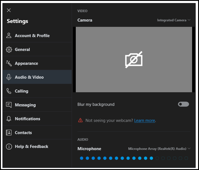 Title: Screenshot of Skype Settings screen on Desktop computer - Description: The screeenshot features a grey square containing the image of a white camera with a line through it. Below the square there are the words 'Blur my background' featuring a grey button to the right of the words which has been moved to the left.