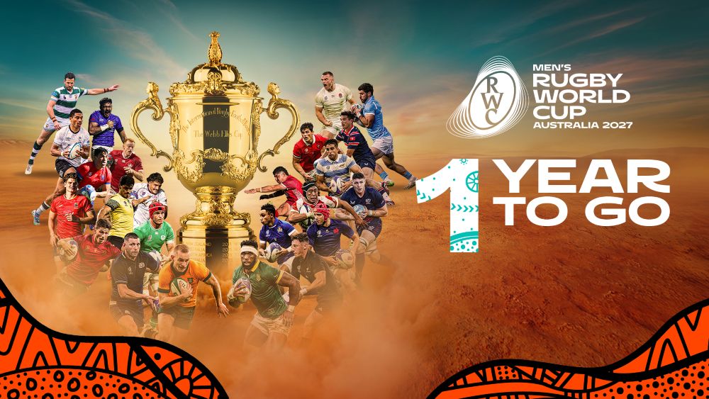 Image of Men’s Rugby World Cup 2027 1 Year to go wording. Under is the Webb Ellis Cup – the trophy awarded to the winning nation surrounded by players from many of the World Cup competing countries 