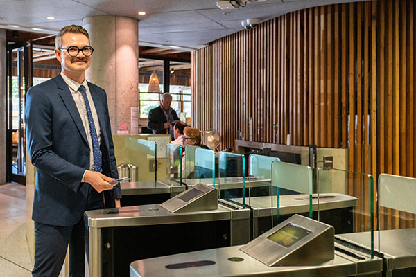 Alex Webb passing security in the Nishi Building