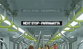 Image showing on-board next stop announcment sign in a rail carriage.
