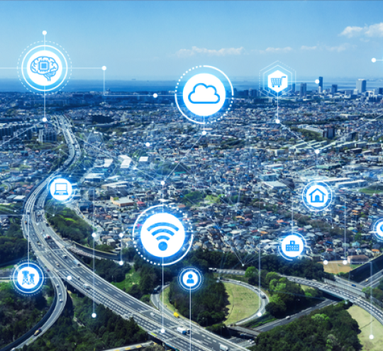 A blue tinged daylight city scape with wifi and other technology symbols superimposed