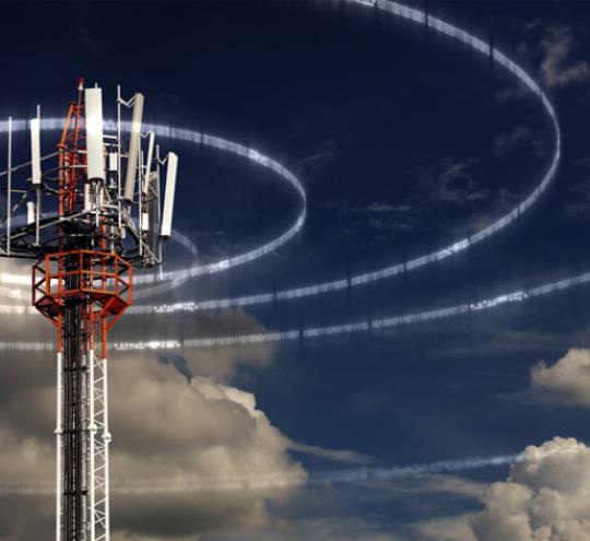 Mobile tower with rings made of ones and zeros radiating outwards