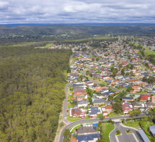 Aerial view of houses in the suburb of Glenmore Park in NSW, Australia of residential area and motorway in Brisbane Queensland.