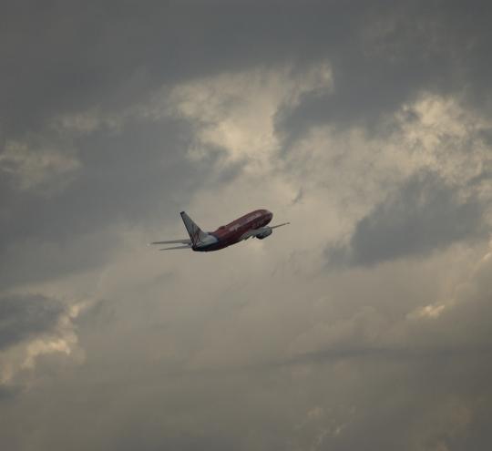 Aeroplane in the sky amongst clouds.