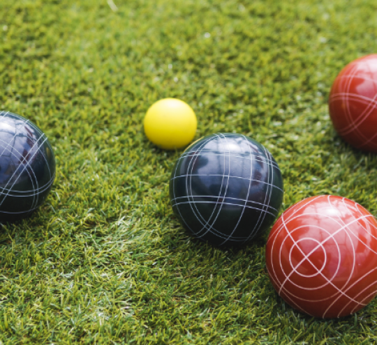 Boccia balls on a green.