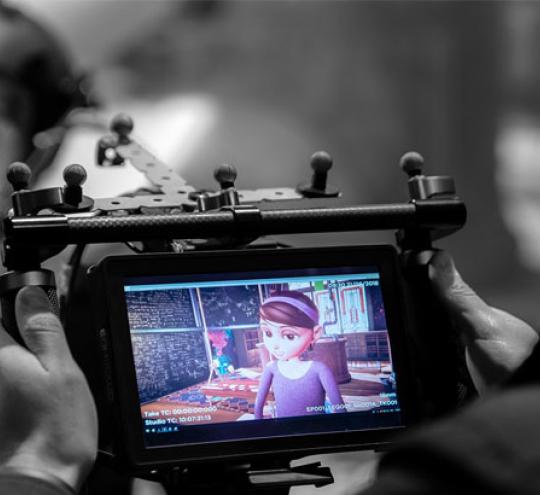 Person filming motion capture animation.