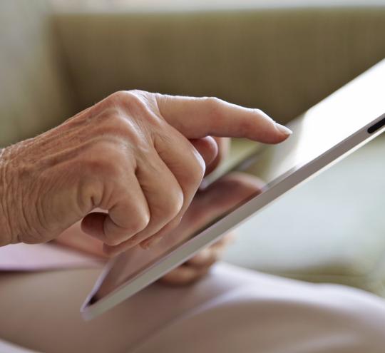 Older woman using tablet