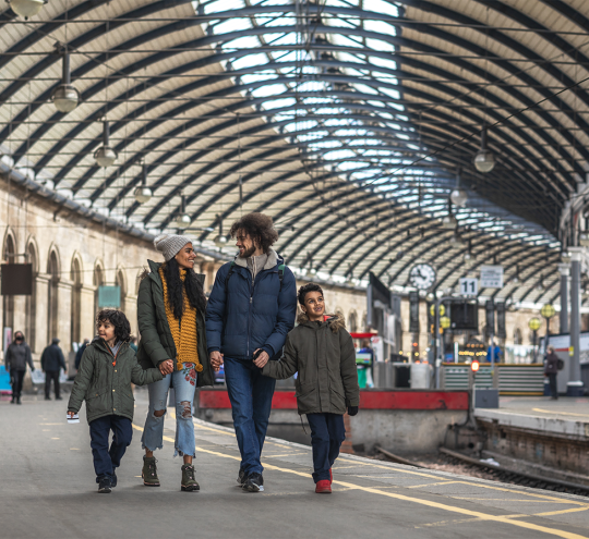 Family at a railway station. 