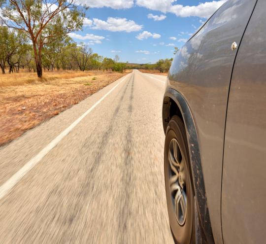 Car driving along an Outback highway
