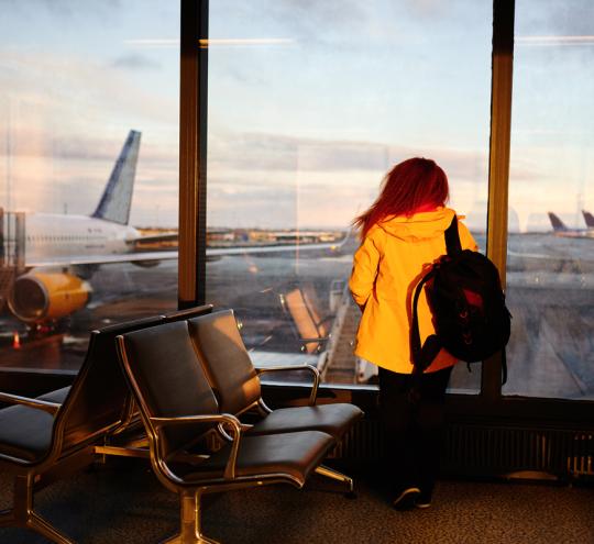 Waiting For The Plane Looking Out On The Window