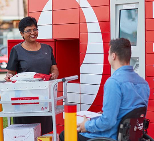 austalia post worker scanning parcel