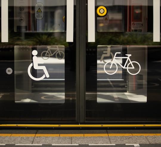 light rail carriage door, showing the International Symbol of Access.