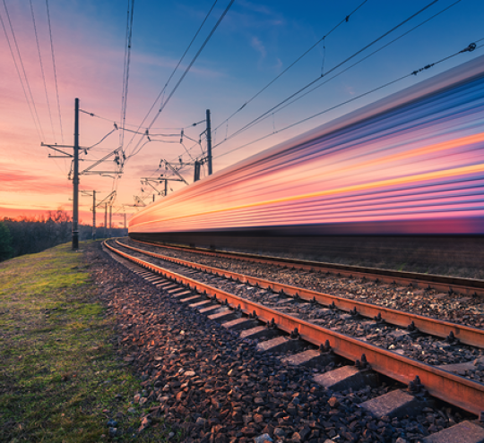 High-speed train passes in blur of motion.