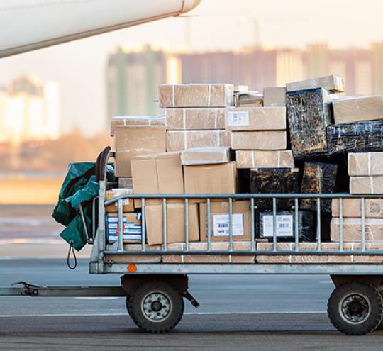 Image depicts cargo being loaded onto an aircraft.