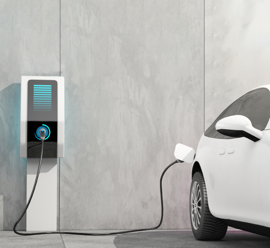 Electric vehicle with charger plugged in 