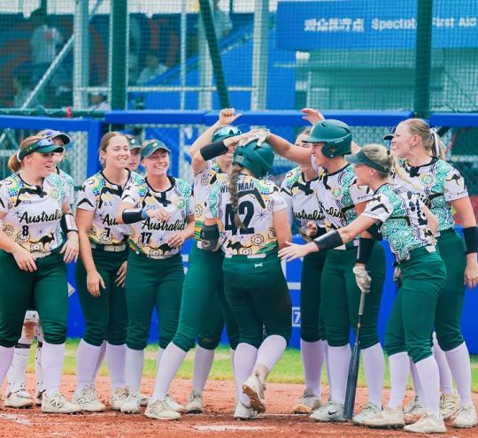 Australian softball players celebrating