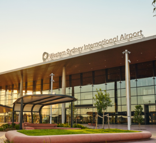 Entrance to Western Sydney International Terminal at sunset.