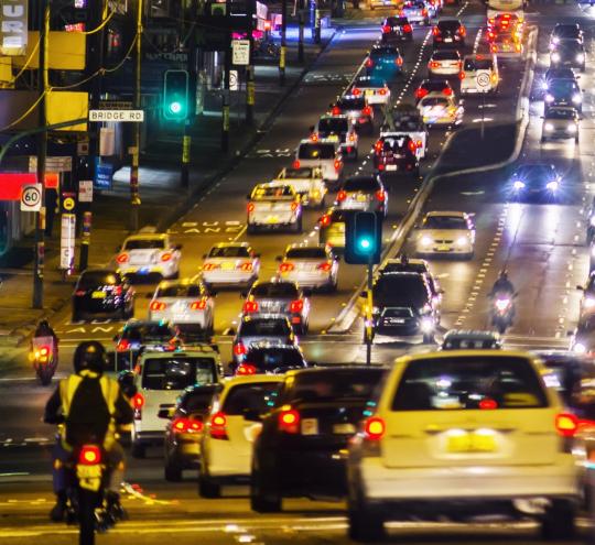 Busy metropolitan street at night.