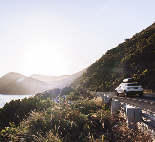 car travelling on coastal road
