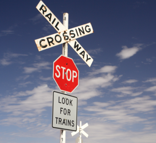 Railway crossing and stop sign.