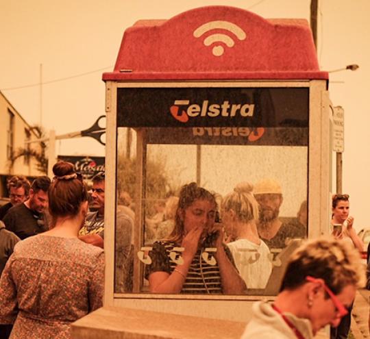 A payphone being used in bushfires at Narooma, January 2020. Photo credit: Tim Roche.