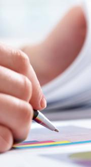 Person writing reports.
