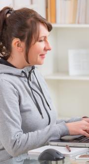 Hearing impaired woman using a laptop