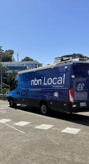 New NBN Co Powercube next to a blue NBN Co RoadMuster truck. Image supplied by NBN Co.