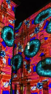 An art installation projected onto building facades in Melbourne.