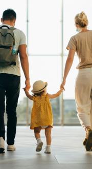Family walking through an airport