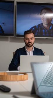 Business meeting on laptops.