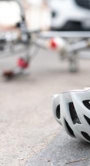 overturned bicycle and helmet on road