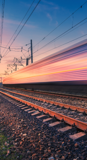 High-speed train passes in blur of motion.