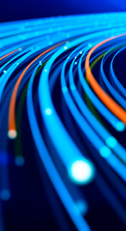Close up of network data flowing on a dark blue background.
