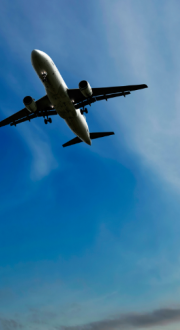 Plane flying up against a blue sky 