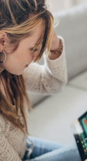 Person looking at an online gambling website on their tablet