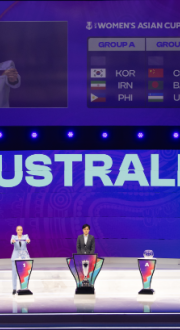 Draw Assistant and Australian soccer player Tameka Yallop displays Australia during the draw for next year's Women's Asian Cup at the Town Hall in Sydney, Australia on Tuesday 29 July 2025.
