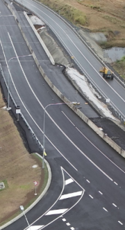 Construction crew and their vehicles on Lion Creek Bridge