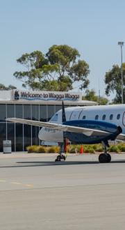 Rex Airlines plane at regional airport.