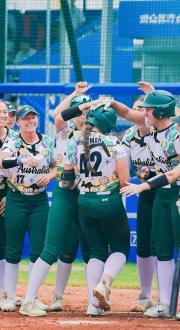 Australian softball players celebrating