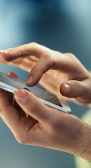 hands interacting with a mobile phone