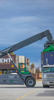cargo container being loaded on to truck