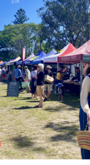 Image depicts community at a farmers market.