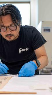 Team of archivists preserving documents.