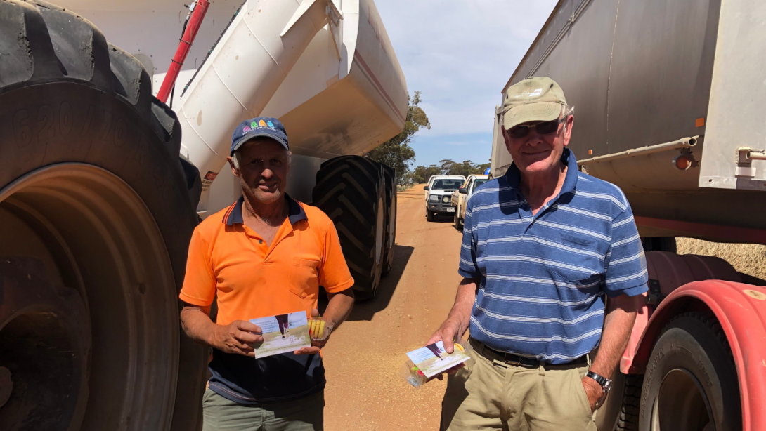 Photo of two men with showing Kooka biscuits. Photo credit: Buloke Shire Council, VIC