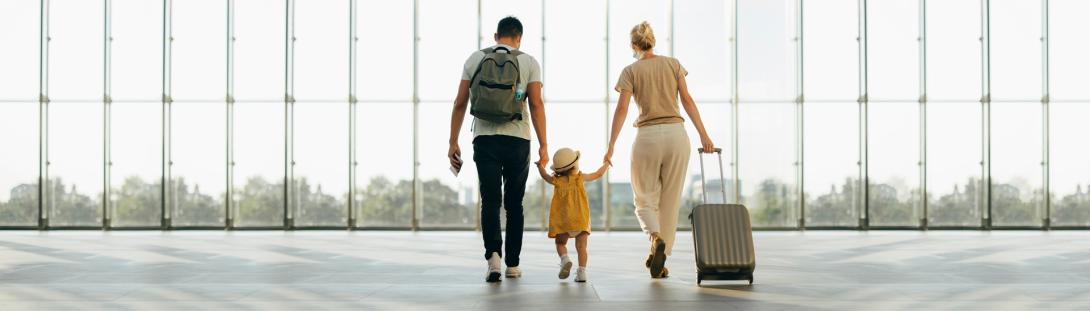Family walking through an airport