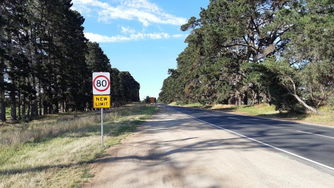 Photo of an 80km/h road with a sign underneath saying “NEW LIMIT”. Photo credit: Mornington Peninsula Shire Council, VIC
