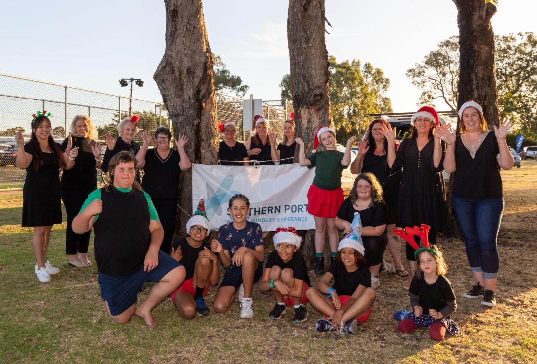 Posed group photo of the Festive Auslan Choir at the at the Movies by Moonlight event in Burekup. Photo credit: Shire of Dardanup, WA.