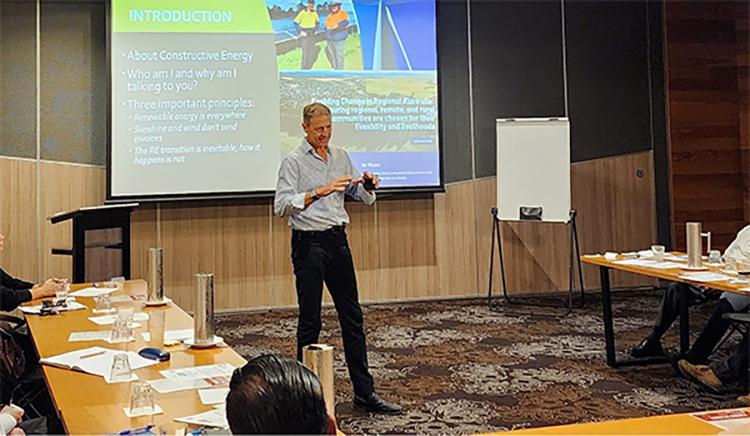 Ashley Bland presenting at the Regional Energy Transition Collaborative Forum. Photo of person presenting to a group of people.